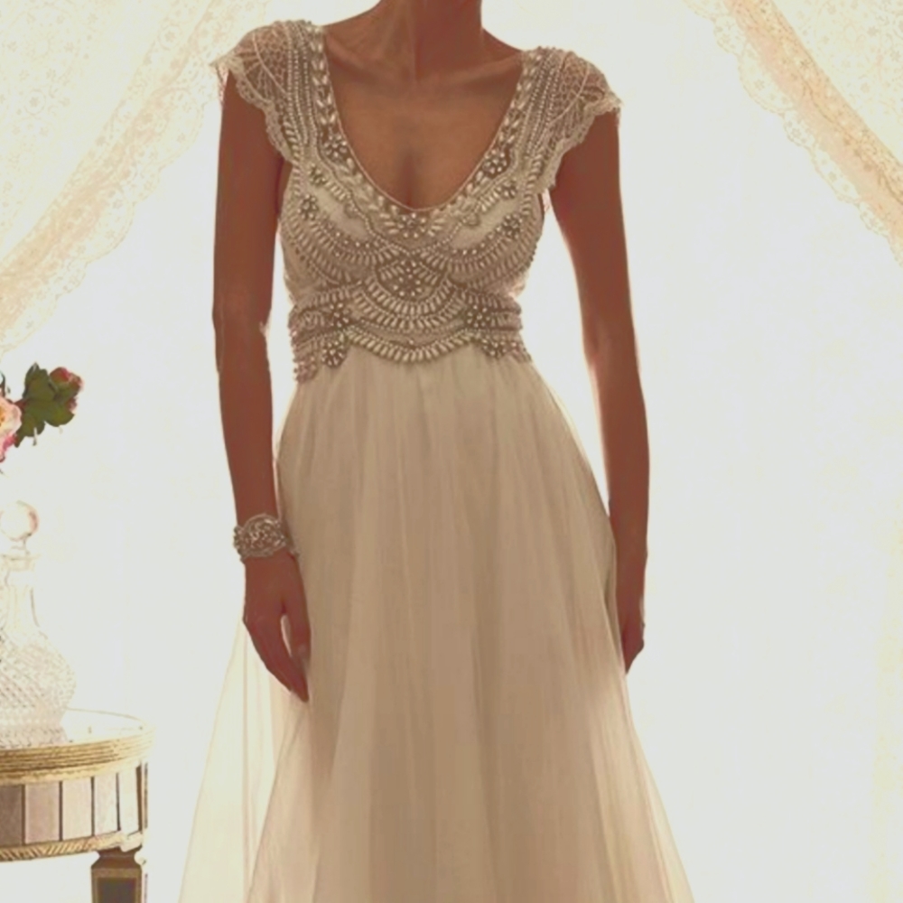 Bohemian style Beaded lace cap sleeve wedding gown.